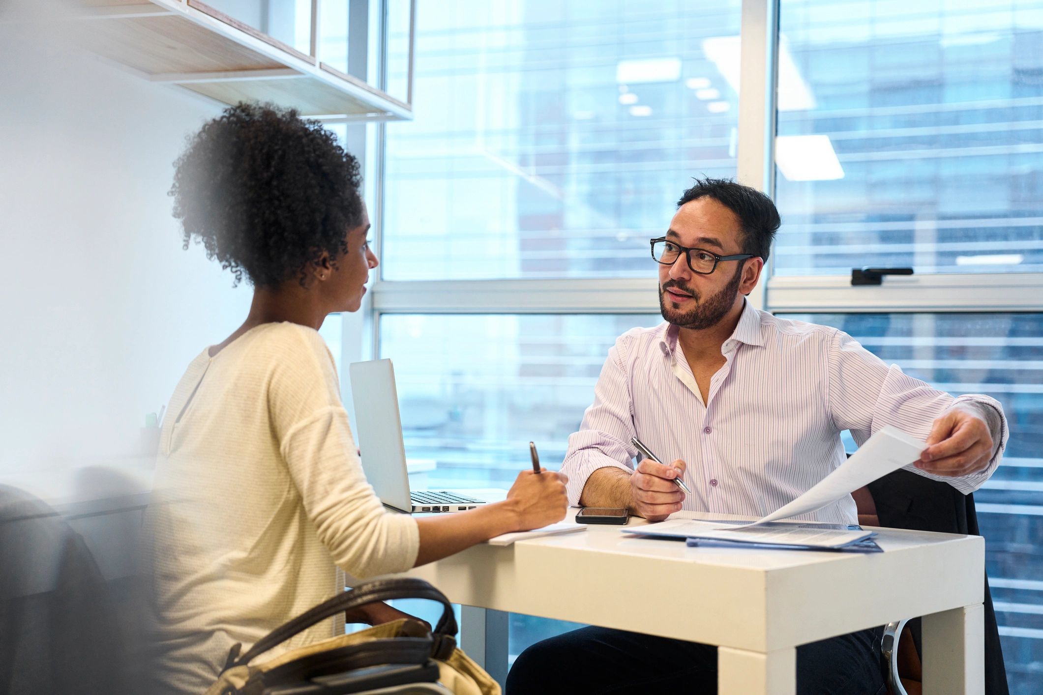 Tax advisor consulting a client in an office